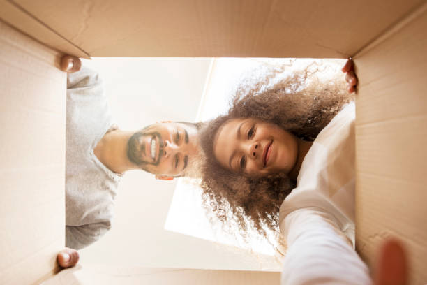 Man and a girl looking into a box