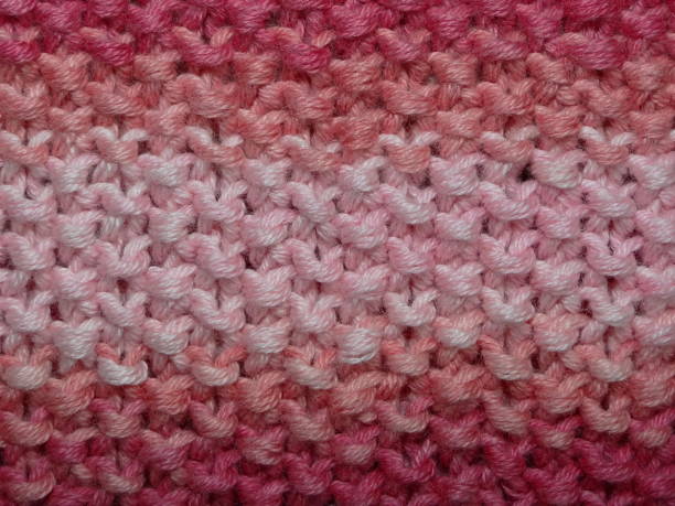 istock beautiful knit fabric with red and beige tones, closeup 667316224