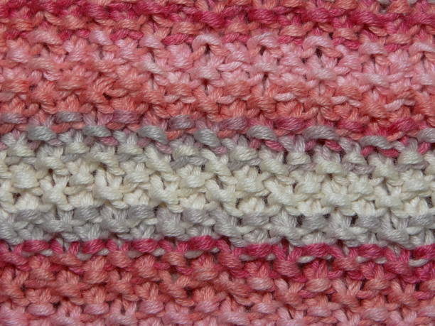 istock beautiful knit fabric with red and beige tones, closeup 667316538