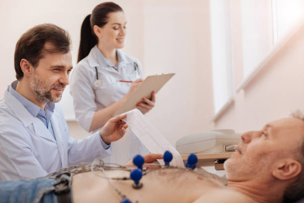 istock Prominent medical worker assisting her colleague 667319356