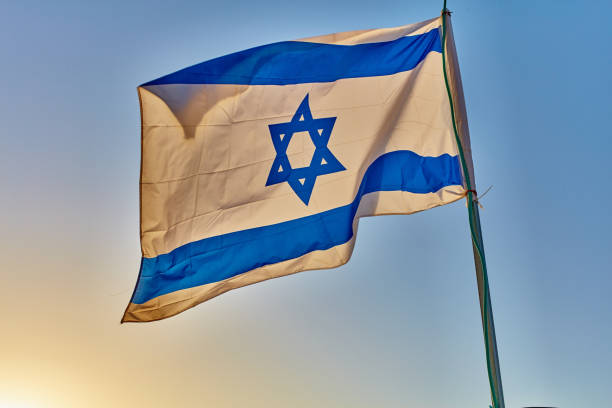 istock Israel flag at sunset 667320856