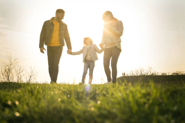 istock Happy family heaving fun in the park. 667329256