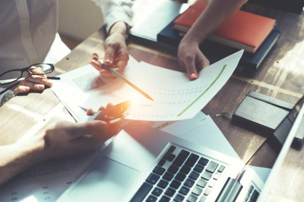 istock Group of young business people working together 667329276