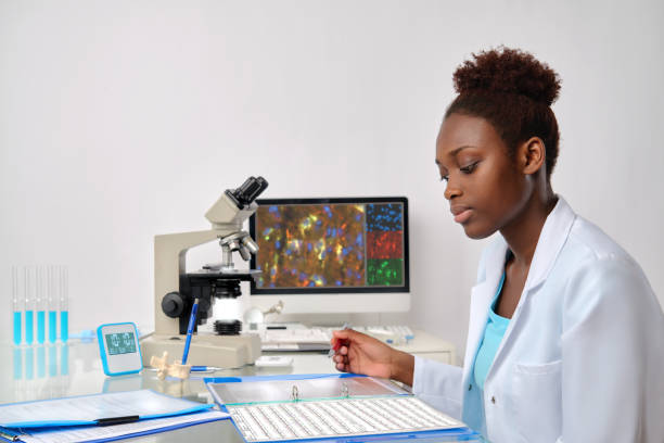 istock African-american biologist checks  sequencing records 667331716