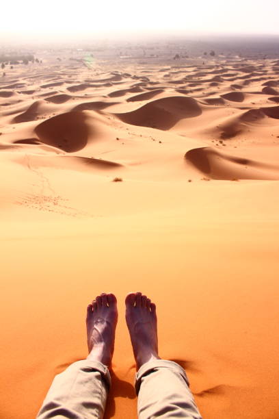 istock a man resting on the desert in sahara of morocco 667335900