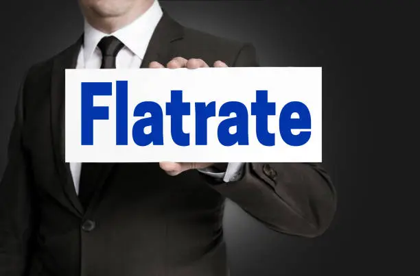 Flatrate sign is held by businessman concept.
