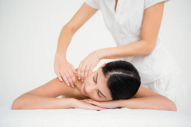 istock Pretty brunette enjoying a massage 667341086
