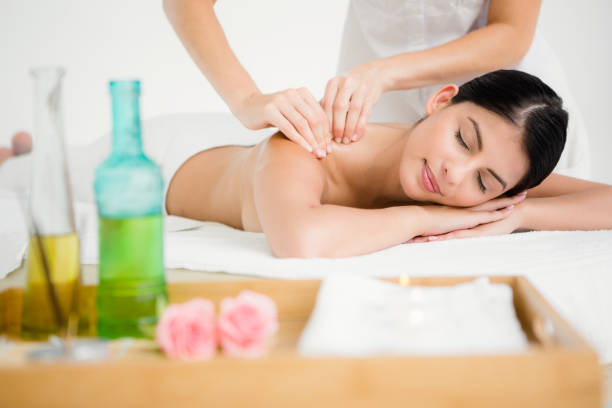 istock Pretty brunette enjoying a massage 667341570