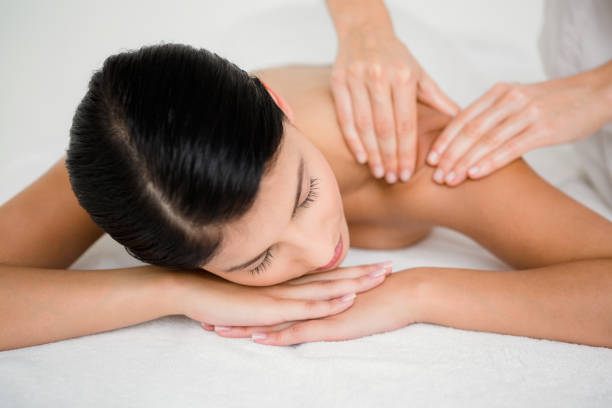 istock Pretty brunette enjoying a massage 667341698