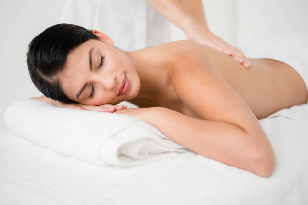 istock Pretty brunette enjoying a massage 667341730