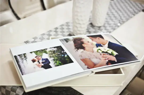 Photo of White classic wedding book and album