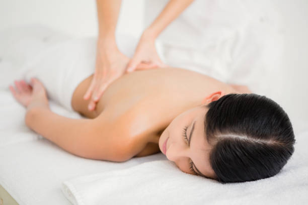 istock Woman receiving a back massage 667342012