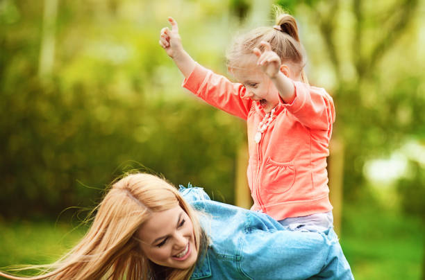 istock Mother and Daughter Enjoying Spring 667342078