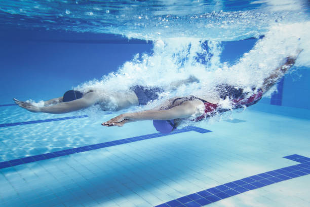 istock swimmer  Jump from platform jumping A swimming pool.Underwater photo 667342242