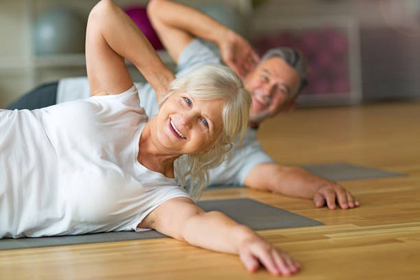 istock Mature couple doing fitness exercises 667345590