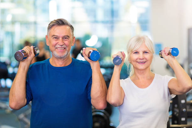 istock Mature couple doing fitness exercises 667345656