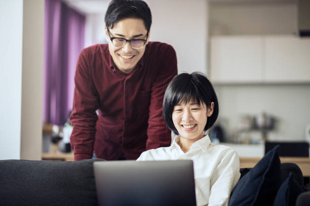istock Couple working on laptop in home 667345664
