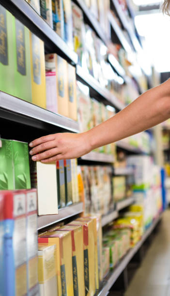 istock Cropped image of woman picking a box in shelf 667348828