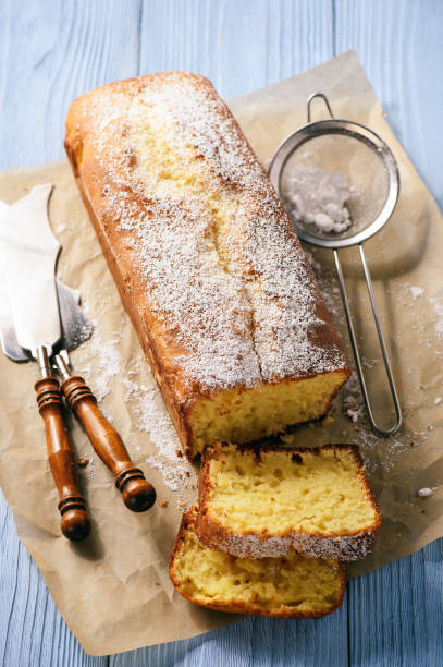 istock Sliced vanilla pound cake on wooden background. 667353122