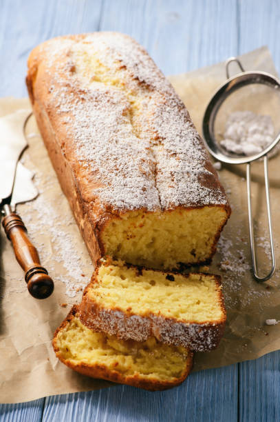 istock Sliced vanilla pound cake on wooden background. 667353134