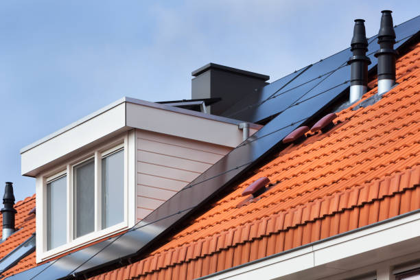 Dormer and solar panels Dormer and solar panels on a red tile roof dormer stock pictures, royalty-free photos & images