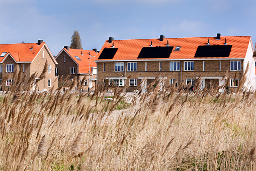 Solar panels on residential housing rooftops in the Netherlands