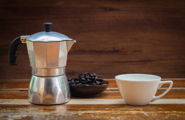 istock still life coffee bean and cup on wood 667354098