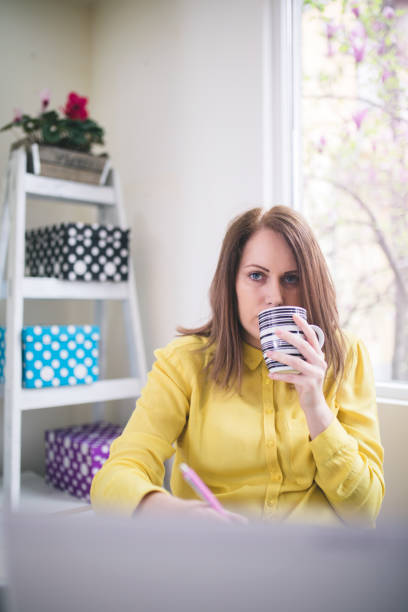 istock Young businesswoman on a coffee break. Using tablet computer. 667354126