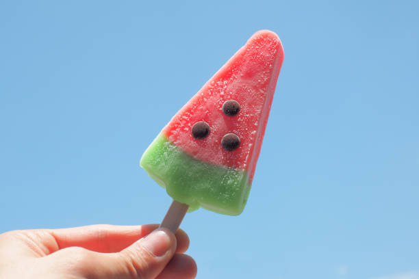 istock watermelon ice creams on blue sky background 667356744