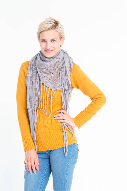istock Smiling woman posing in front of white backdrop 667361146