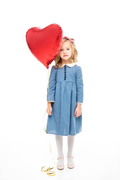 istock Girl with heart shaped balloon 667371188