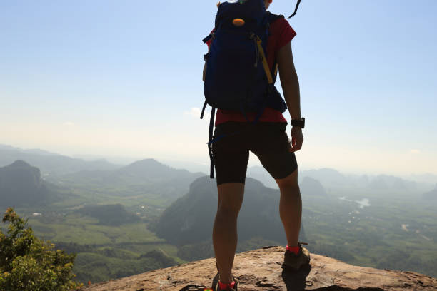 istock young woman backpacker enjoy the view on mountain peak 667375742