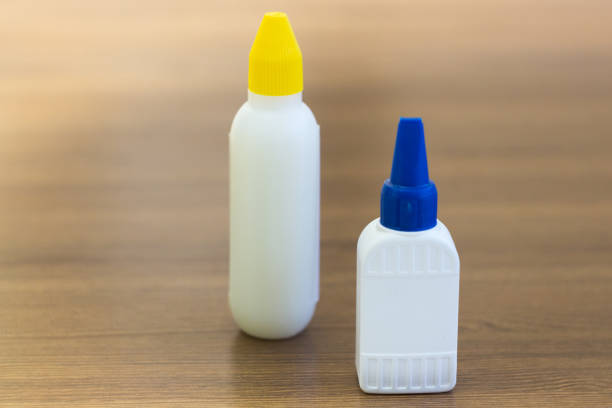 istock two empty blank bottles or vials on wood background 667375958