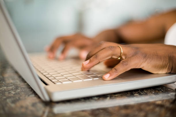 istock Masculine hands typing on laptop keyboard 667376854