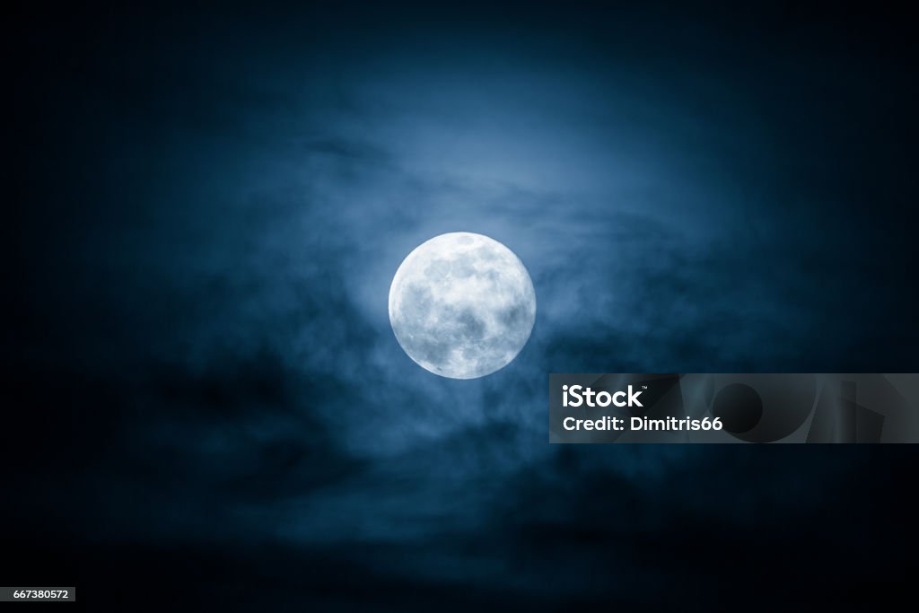 Full Moon and clouds on the night sky Full Moon and clouds on the night sky. Moon Stock Photo