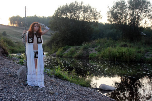 istock girl from the tribe with spear river 667385558