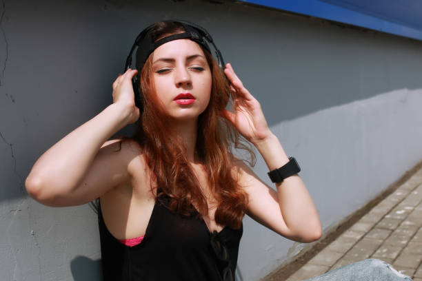 istock hipster girl at the blue wall 667391024