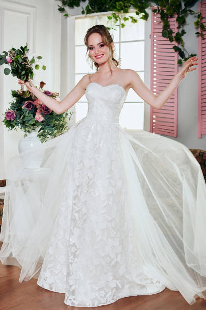 istock Young attractive bride with flowers 667394796