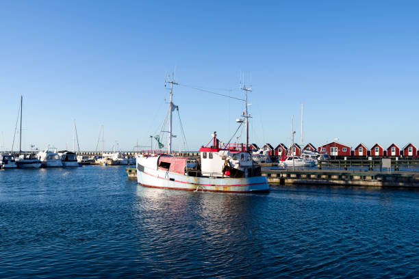 istock Denmark: A fishing cutter leaves the harbor 667396238