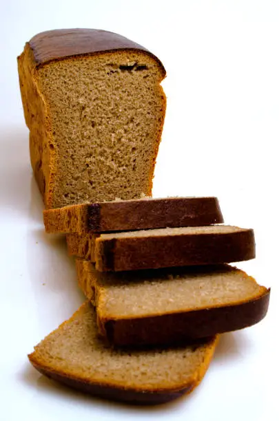 Russian bread, rye-wheat, Darnitsky on a light background.