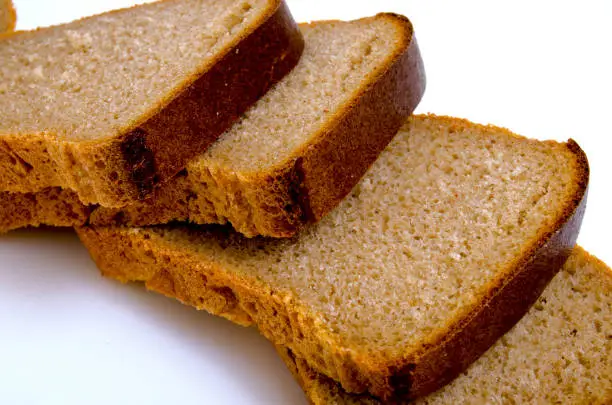 Russian bread, rye-wheat, Darnitsky on a light background.