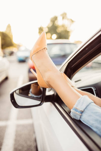 istock Close up of legs through car window 667400004