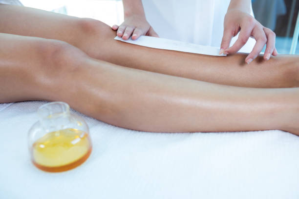 istock Woman getting her legs waxed 667402934