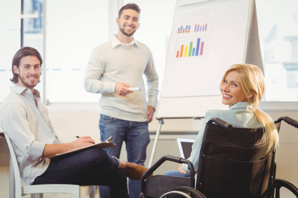 istock Confident business people with whiteboard during meeting 667403006