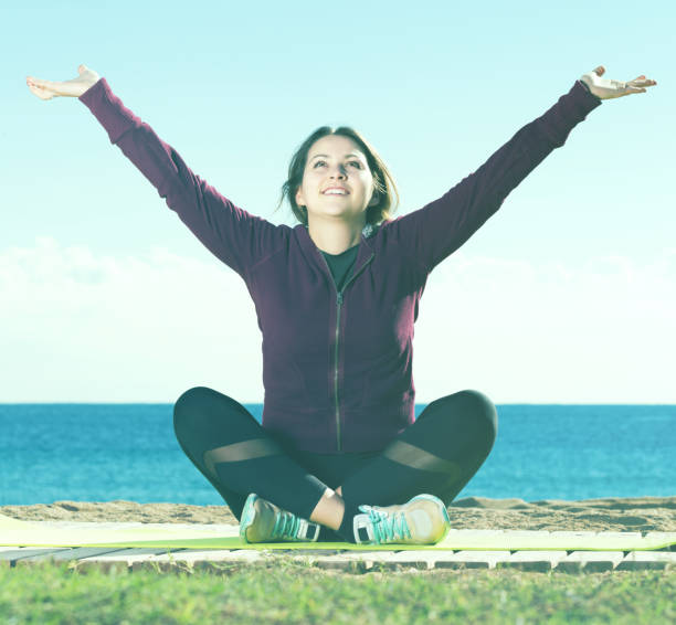 istock Ordinary young woman training yoga 667403414