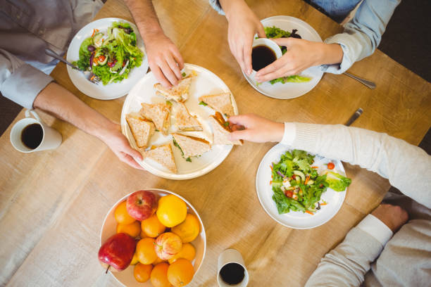 istock Business people having lunch in canteen 667406934