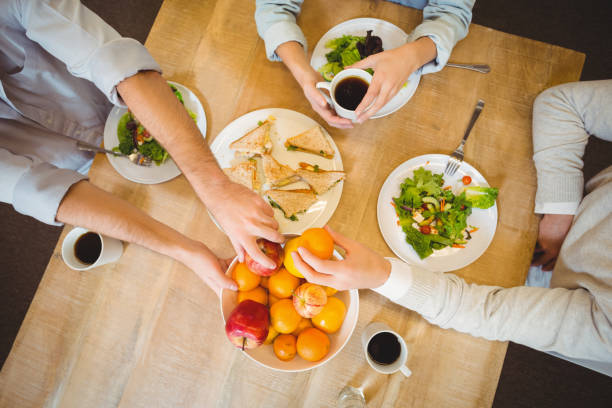 istock Business people having breakfast in canteen 667407012