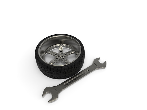 Car rim with tire and wrench. 3D rendering.