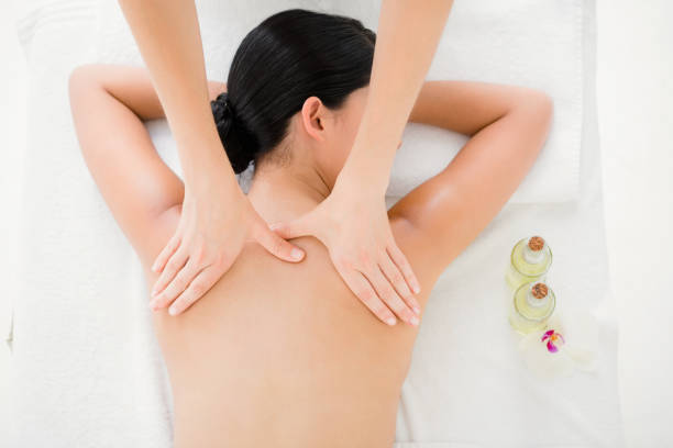 istock Woman receiving a back massage 667417600