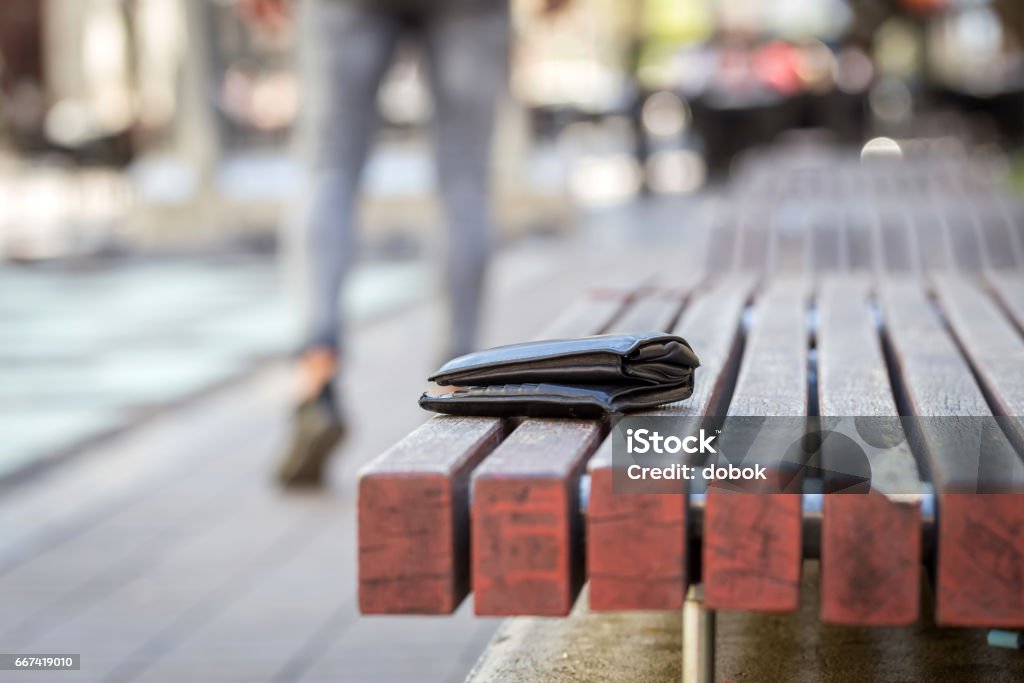 man lost his wallet man lost his wallet on a bench on street Lost Stock Photo